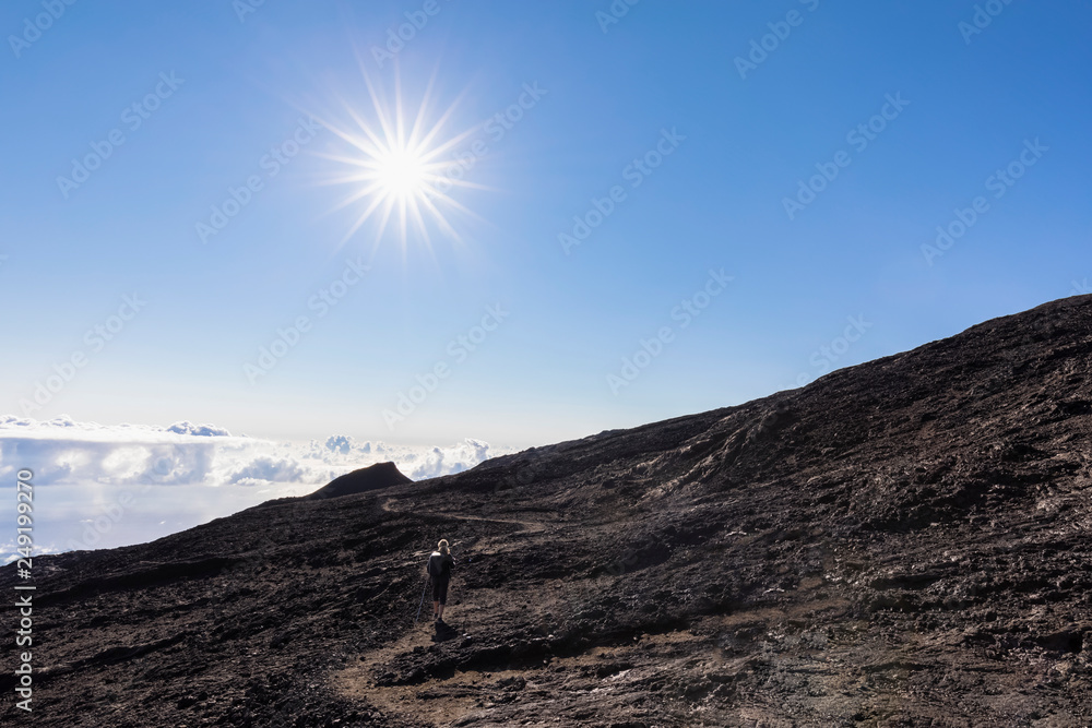 Reunion, Reunion National Park, Shield volcano Piton de la Fournaise, female tourist hiking to crater