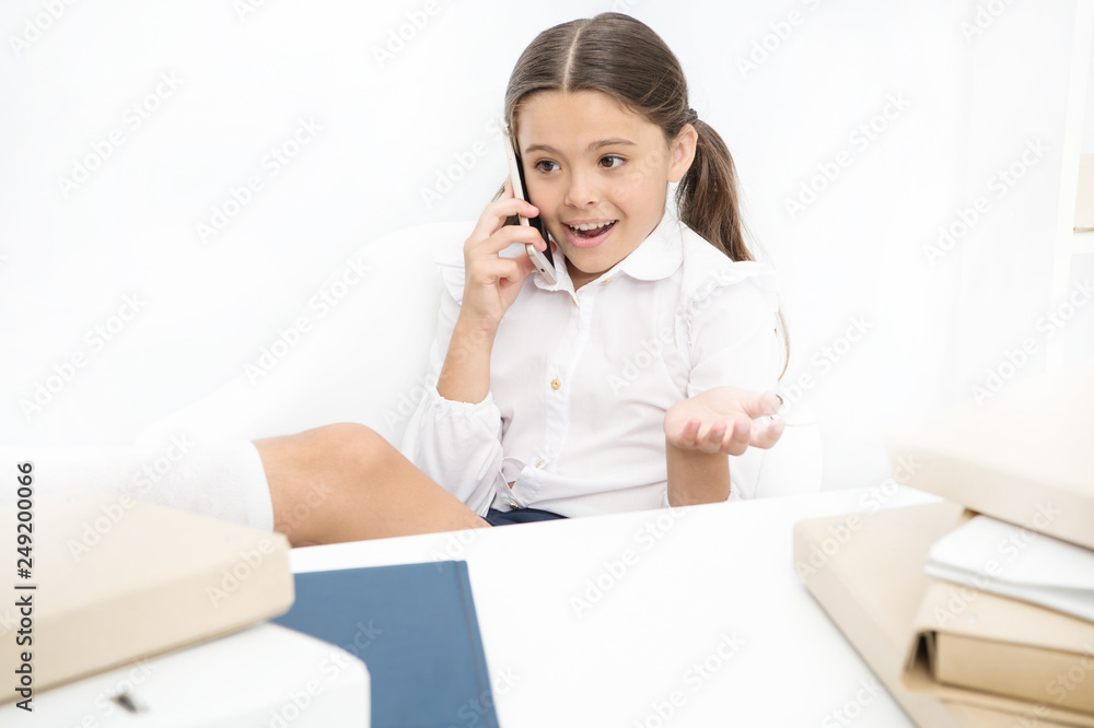 Child use smartphone mobile to communicate in school. Fresh school gossip. She like talking too much. Discussing rumors. Cute gossip girl. Schoolgirl smiling face discuss fresh gossips with mates Child use smartphone mobile to communicate in school. Fresh school gossip. She like talking too much. Discussing rumors. Cute gossip girl. Schoolgirl smiling face discuss fresh gossips with mates