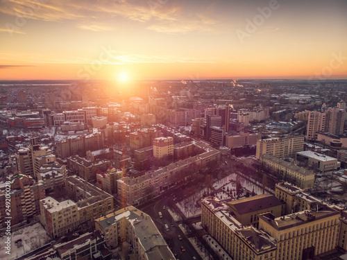 Aerial view of winter midtown of Voronezh city with buildings, roads and skyline at sunset