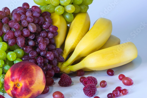 Still life with juicy, appetizing, bright fruits on a light background