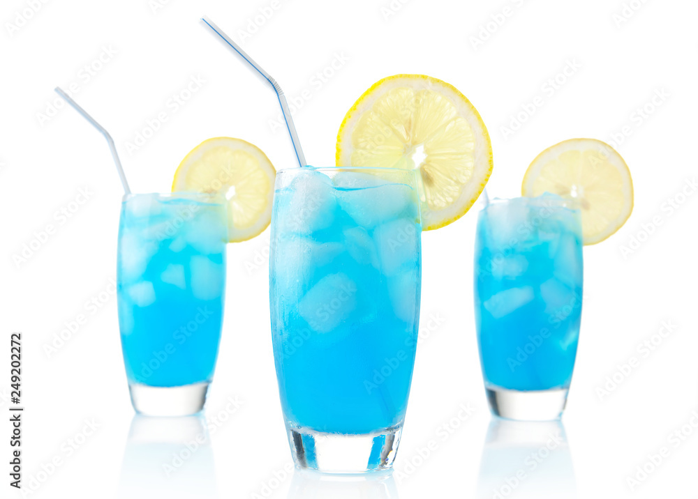 Blue lagoon drinks with slice of lemon with straw isolated on white Blue lagoon drinks with slice of lemon with straw isolated on white