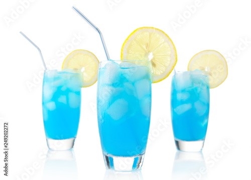 Blue lagoon drinks with slice of lemon with straw isolated on white