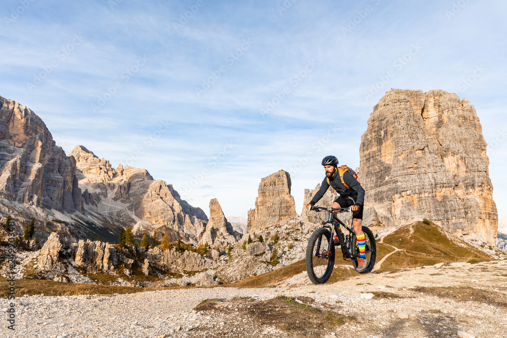 Italy, Cortina d'Ampezzo, man cycling with mountain bike in the Dolomites mountains Italy, Cortina d'Ampezzo, man cycling with mountain bike in the Dolomites mountains
