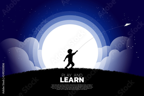 silhouette of boy running to throw out origami paper airplane at night. Concept of children play and learn.