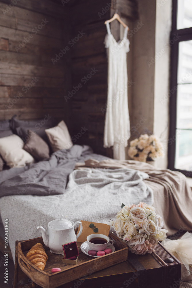 Wedding decor of bedroom with wedding accessories. Bride's morning and preparation Wedding decor of bedroom with wedding accessories. Bride's morning and preparation