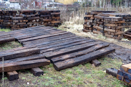 Old wooden railway ties. Renovation and replacement of tracks in the engine house.