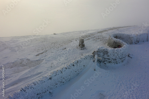 penyghent summit covered with snow photo