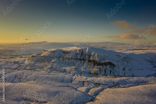 Ariel Shot of penyghent covered in snow