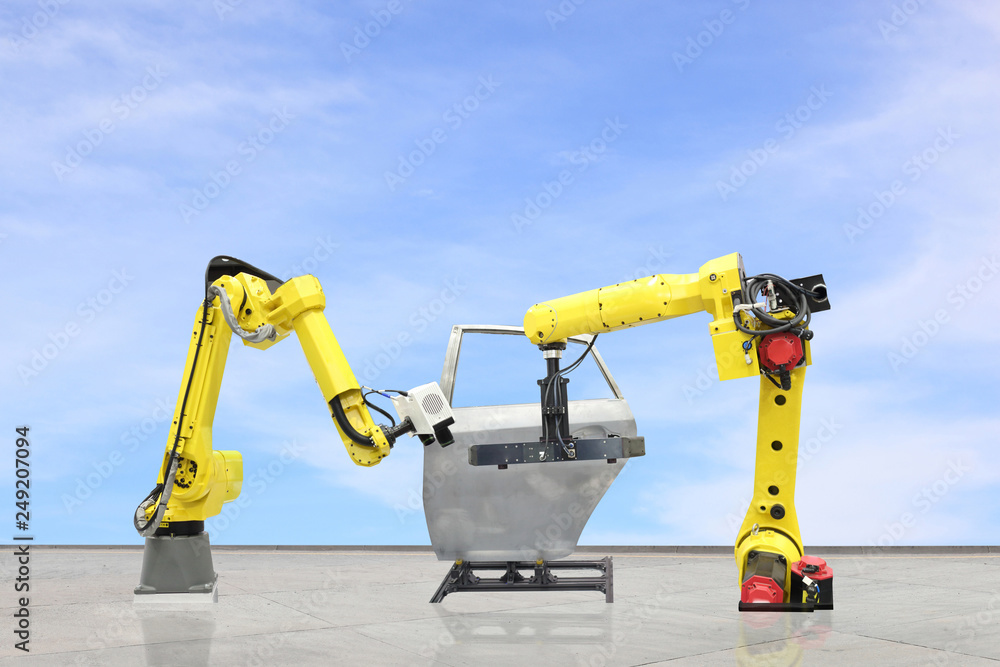 automate wireless Robot arm in smart factory background. Mixed media in the automotive parts industry automate wireless Robot arm in smart factory background. Mixed media in the automotive parts industry