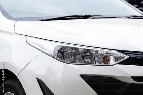 Closeup of headlight white car. © JC_STOCKER