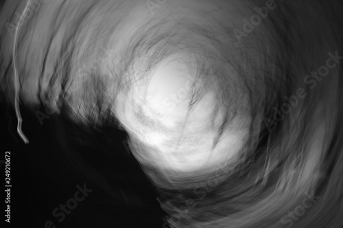 abstract swirling sunset in black and white