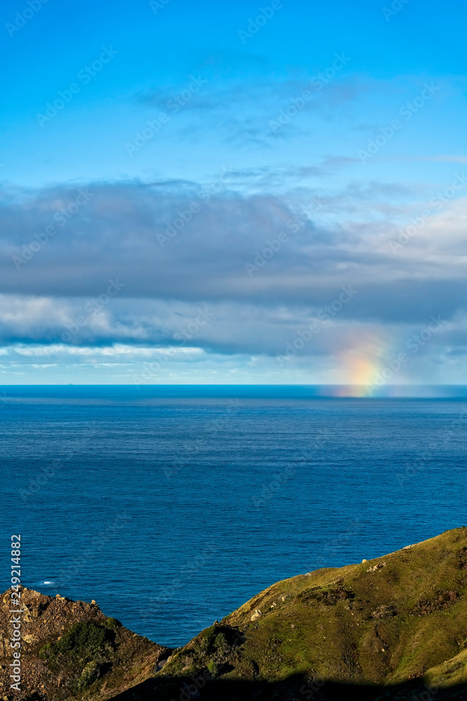 Partial Rainbow from Clouds above Ocean 