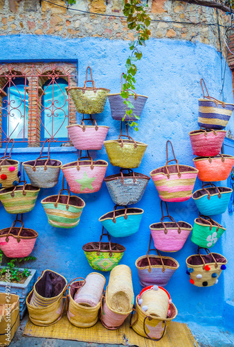 Street market with bags in city Chefchaouen,  Morocco, Africa. © Olena Zn