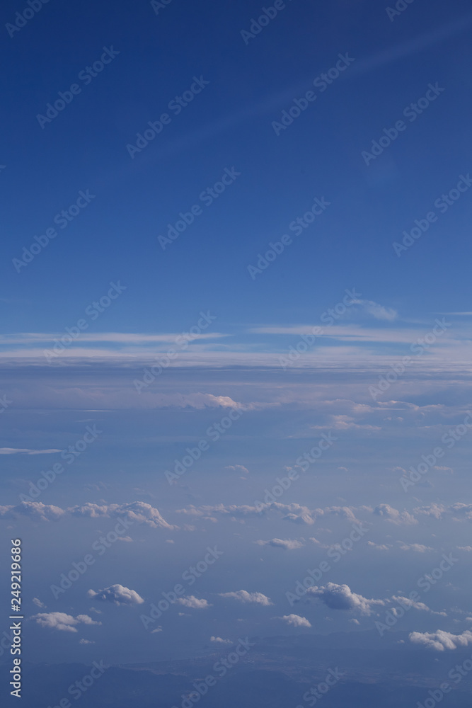 Fototapeta premium Beautiful Above clouds from an airplane