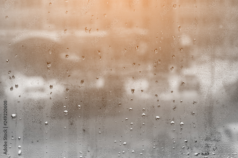 Obraz premium water droplets on glass with blurred boke in background