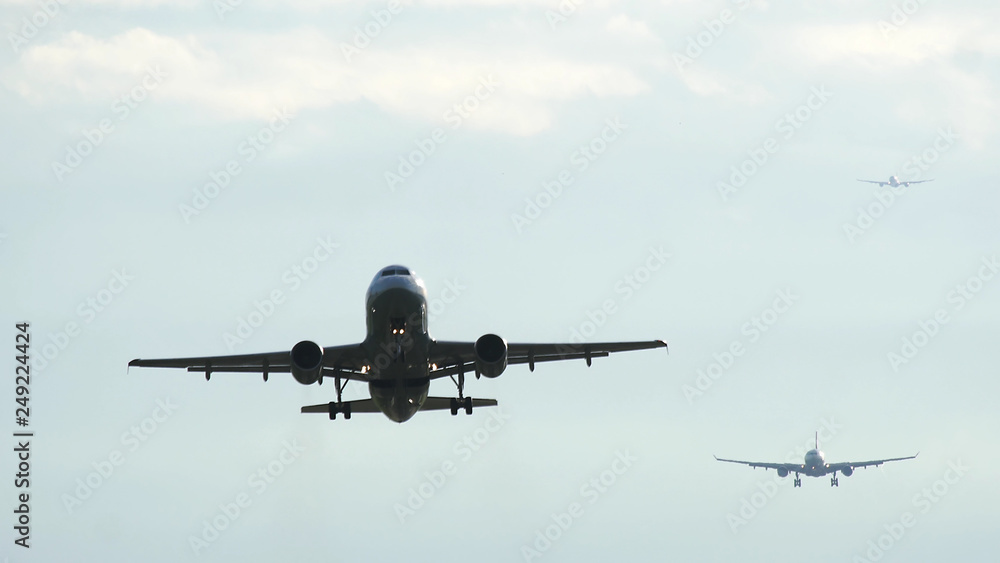 Commercial jet airplane take off in the morning Commercial jet airplane take off in the morning