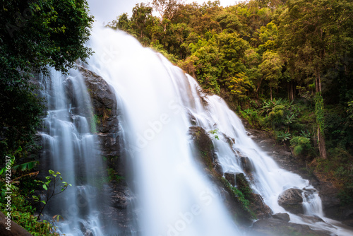 Flowing waterfall in mountain taken in low shutter speed.