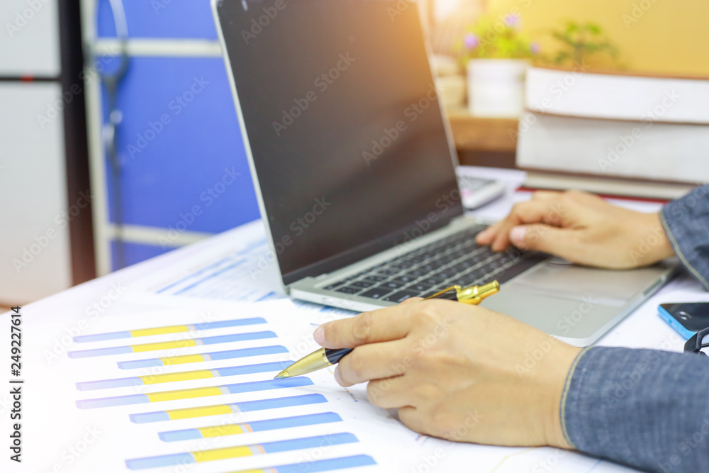 hand businesswomen are typing on notebook to find current online trading trends. hand businesswomen are typing on notebook to find current online trading trends.