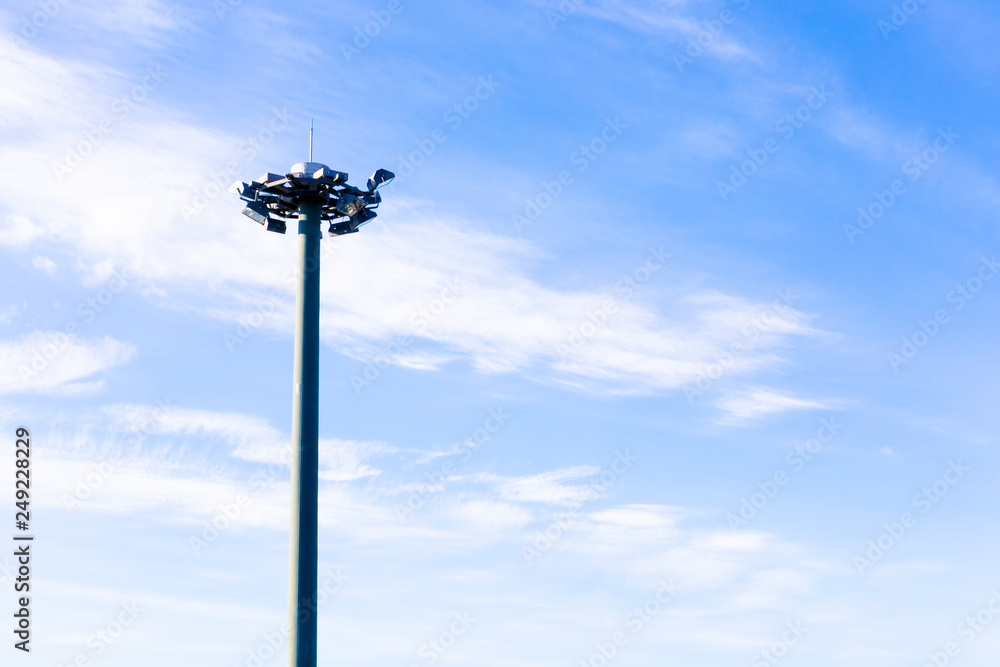 Light pole with blue sky on background