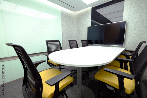 Small meeting room with whiteboard and television accessory for teleconference
