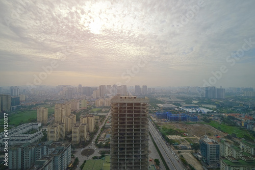 Aerial skyline view of cityscape in Hanoi, Vietnam, on cloudy sky day © Mongkol