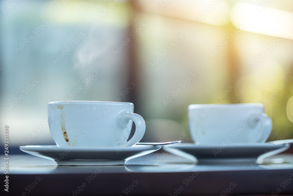 Fototapeta premium two coffee mug on the table in the morning cafe. meeting and talking together concept.