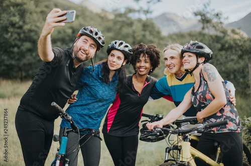 Group of cyclists taking a selfie in the nature