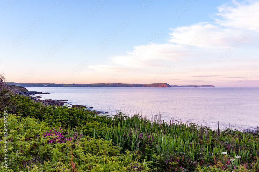 Vibrant colours of Cornish coast at dusk, Portscatho, Roseland Peninsula, Cornwall, England