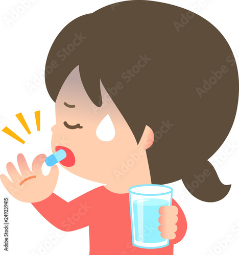 カプセルを飲む顔色が悪い女性