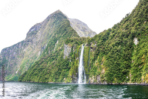 142 meter high glacier waterfall in the Milford sound fjord in southern New Zealand