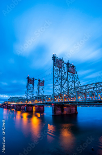 Lifting sectional truss Columbia Interstate bridge over the Columbia River with colorful evening lights