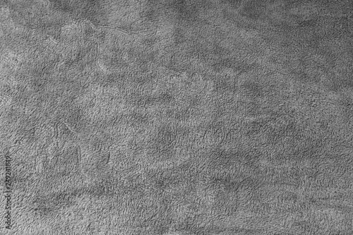 Texture of grey fluffy fleece blanket as abstract background. photo