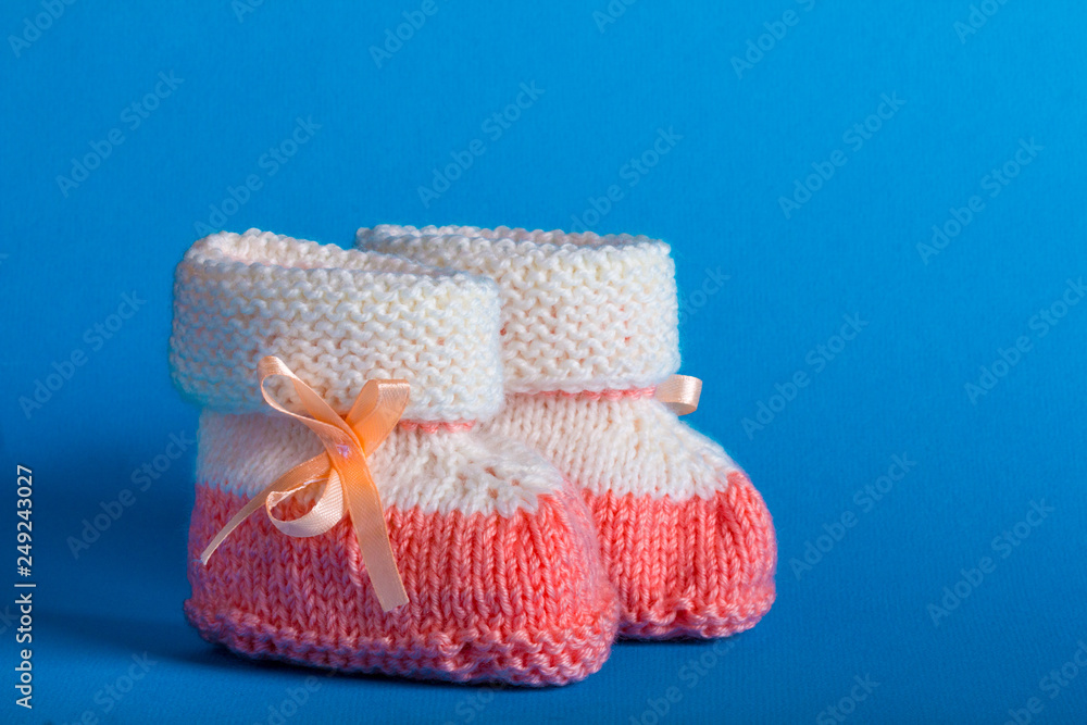 baby's bootees gentle blue background baby's bootees gentle blue background