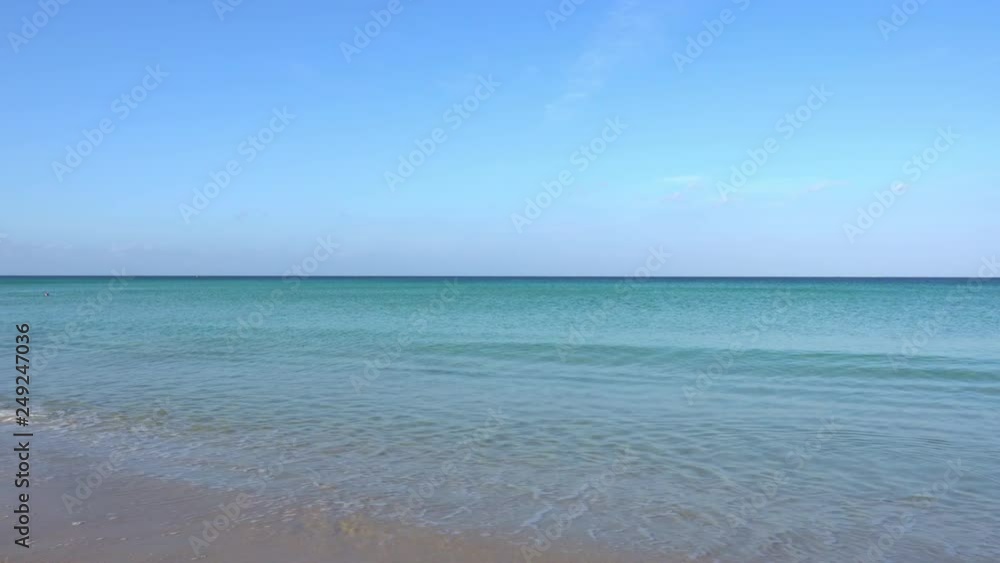 Beautiful Tropical andaman sea white sand and beautiful beach in phuket thailand with wave crashing on sandy shore Beautiful Tropical andaman sea white sand and beautiful beach in phuket thailand with wave crashing on sandy shore