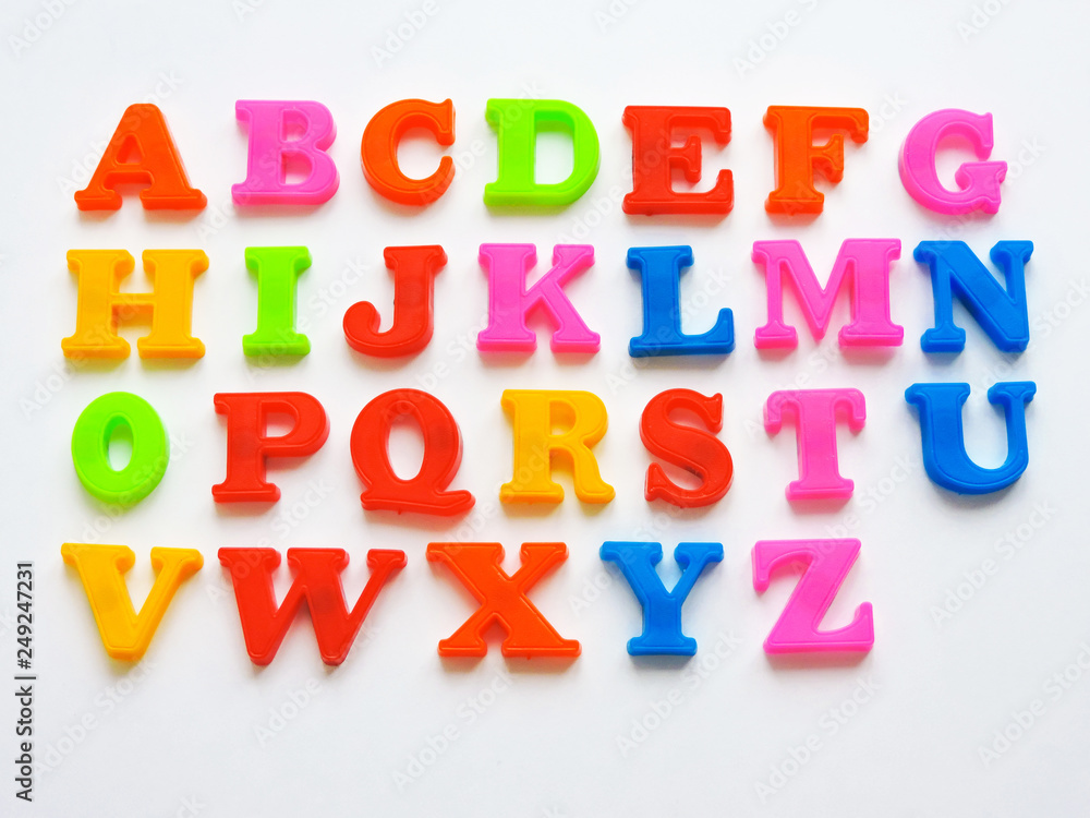Revolutionair sturen Ambient Magnetic Plastic ABC Letters Isolated. Colorful plastic English alphabet on  a white background. Learning english concept.kid is Learning the alphabets  at home. Stock Photo | Adobe Stock