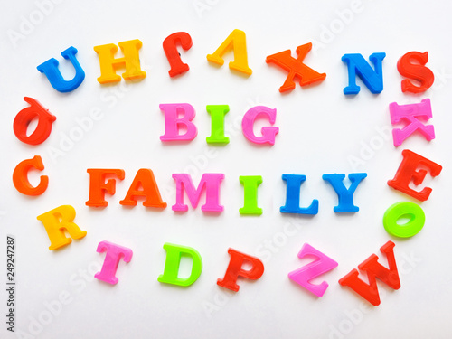     Magnetic Plastic ABC Letters Isolated. Colorful plastic English alphabet on a white  background. Learning english concept.The colorful words "BIG FAMILY  " made with plastic English alphabet.