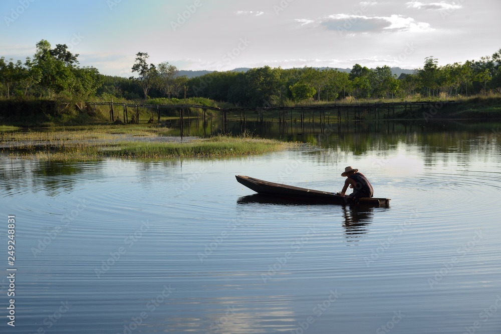 fisherman boat on river and mountain nature fisherman boat on river and mountain nature