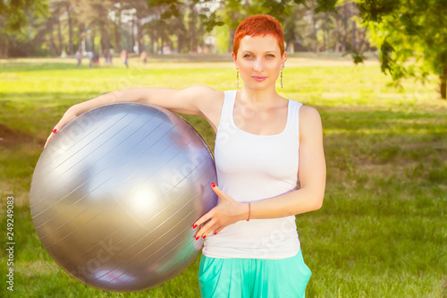 Pilates recreation in nature, fitness ball exercising