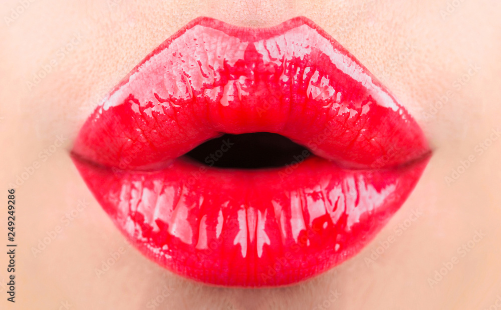 Fototapeta Red lips, beautiful makeup, sensual mouth, sexy lip. Red lipstick or lipgloss. Beauty sensual lips, beautiful lip, bright lipstick. Closeup, macro, mouth, sensual makeup. Sexy beauty lip, skin care.