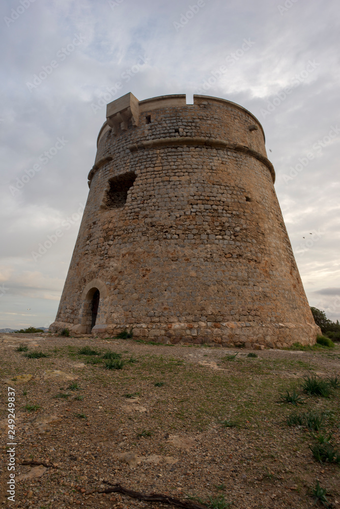 The tower of Sa Sal Rossa at dawn The tower of Sa Sal Rossa at dawn