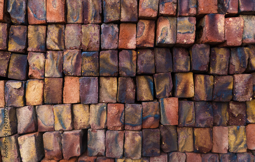 Texture of a brick colored wall  color bricks made in India.
