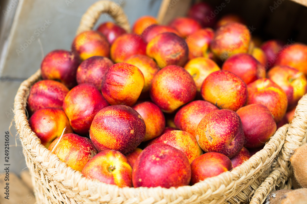 ripe nectarines in wicker baskets on counter ripe nectarines in wicker baskets on counter