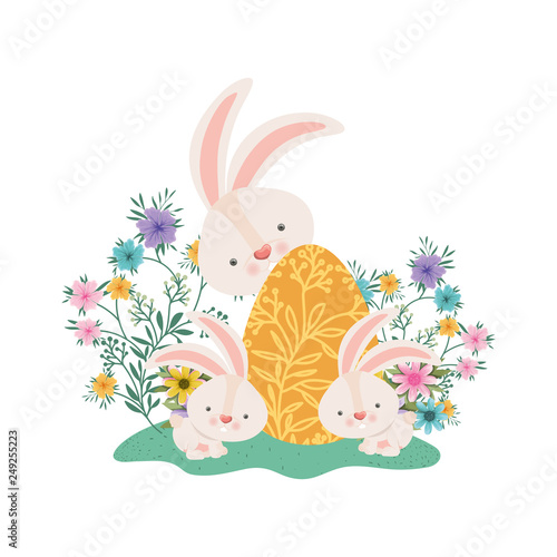 easter rabbits with egg and flowers icon