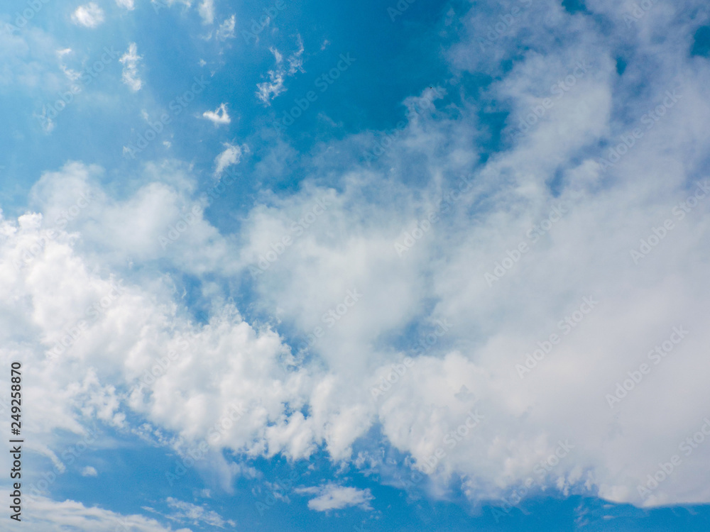 Blue sky with cloud.Sunshine clouds sky during morning background. Over the Clouds. Cloudscape. Blue sky and white cloud. Sunny day. Cumulus cloud. Blue backdrop in the air for text. Top view sky.