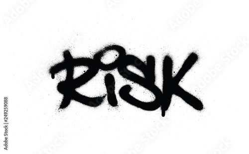 graffiti risk word sprayed in black over white