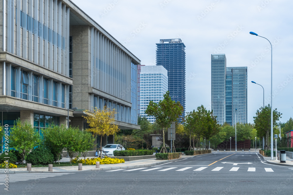 empty road front of modern buildings. empty road front of modern buildings.