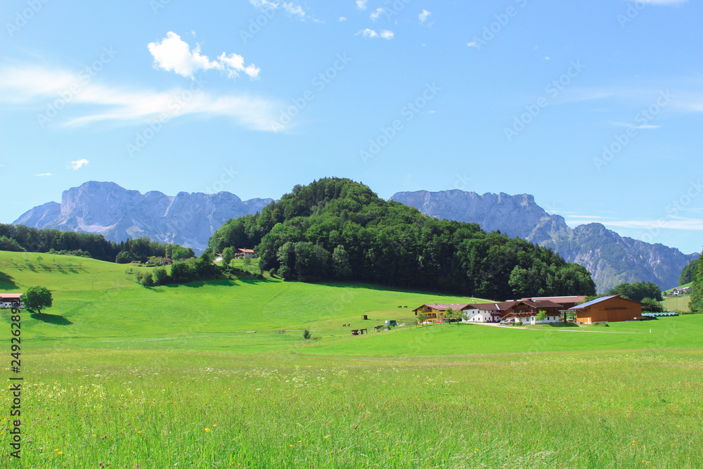 the alps behind a farm the alps behind a farm