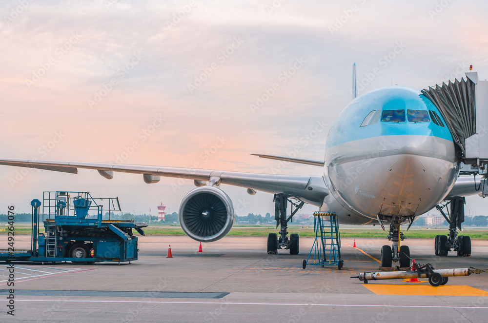 The plane at the airport on loading The plane at the airport on loading