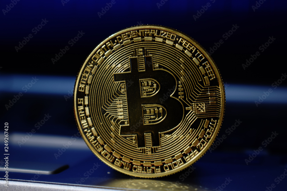 Bitcoin currency with blockchain concept on laptop, Golden Bitcoin. Digital currency close-up. New virtual money. Exchange.