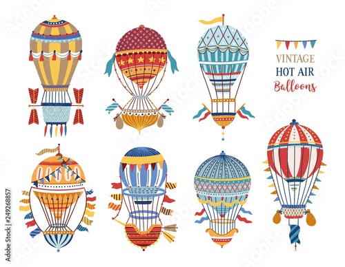 Collection of vintage hot air balloons of different texture and color isolated on white background. Bundle of retro manned flying aircrafts decorated with flags. Vector illustration in flat style.